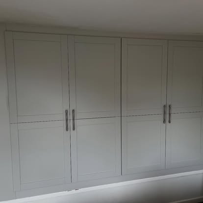 Built-in white shaker wardrobe full wall fitting