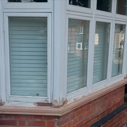 Bay window with new UPVC cill being fitted