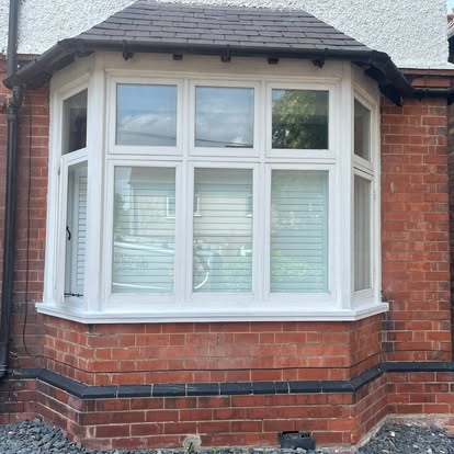 Completed new UPVC bay window with timber cill