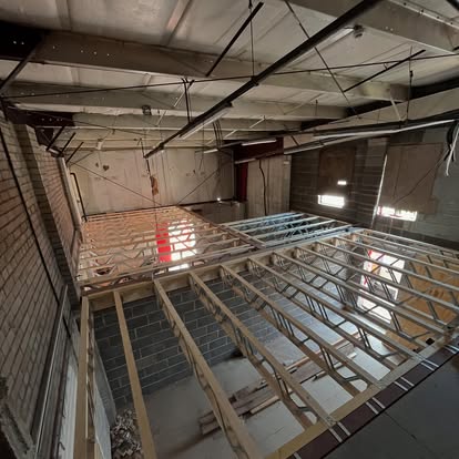 Commercial space with elevated timber floor framework