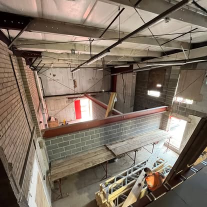 Commercial space timber floor frame and steel ceiling