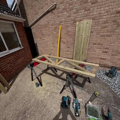 Timber gate frame being assembled on sawhorses