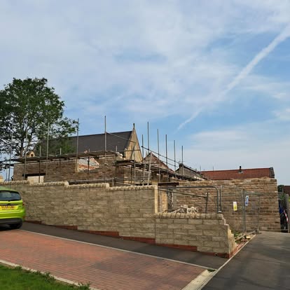 Historic building site with new stonework and scaffolding