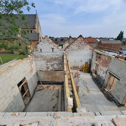 Aerial view of historic brick complex stripped to shell