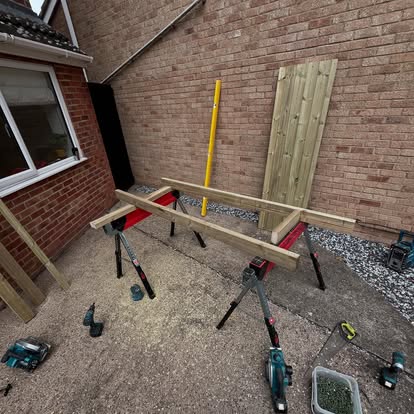 Timber gate components being assembled on sawhorses