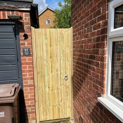 Completed new timber vertical board side gate at house 97