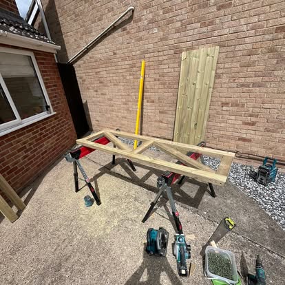 Timber gate frame being assembled on sawhorses
