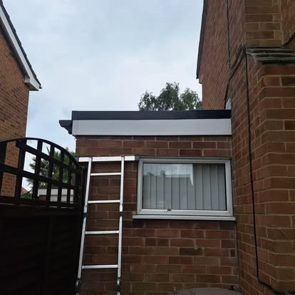 Completed EPDM flat roof on lean-to extension black fascia