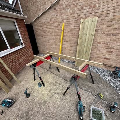 Timber gate frame components on sawhorses