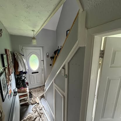 Same hallway with old spindles being stripped out