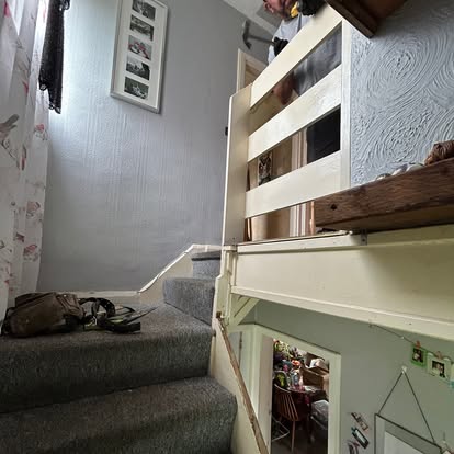 Old painted landing balustrade during strip from above