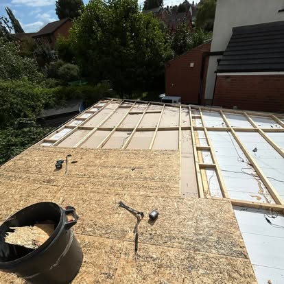 Flat roof timber joists being built for garden room