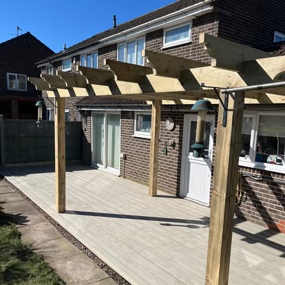 Light timber decking with large pergola frame