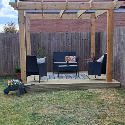 Light timber deck with square pergola and rattan furniture