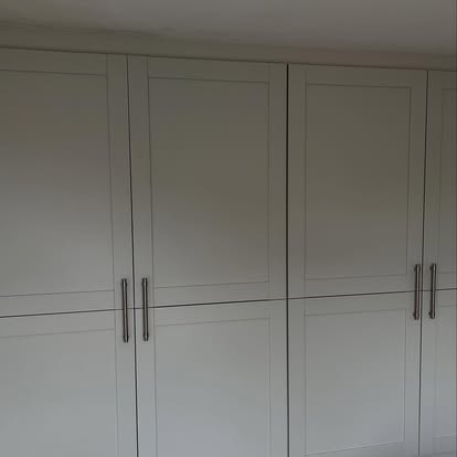 Built-in shaker wardrobe with cream doors