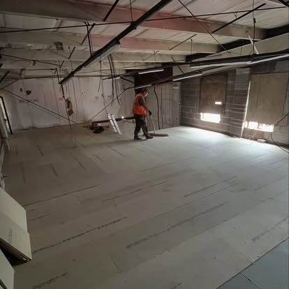 Commercial space insulated floor being laid
