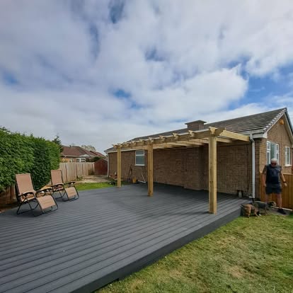 Composite deck and pergola with garden chairs