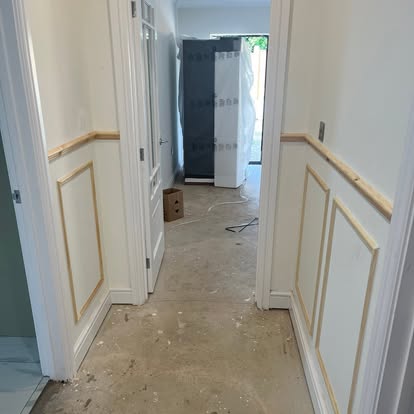 Hallway wainscoting panel mouldings under construction