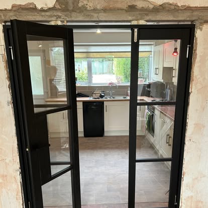 Black steel-framed glazed internal doors installed