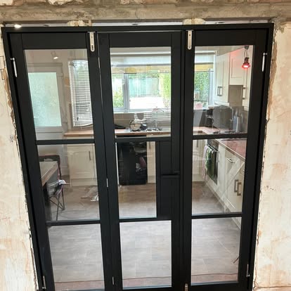 Black glazed internal bifold doors in opening