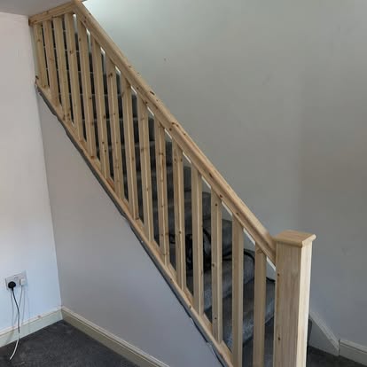 New pine stair spindles and handrail going down