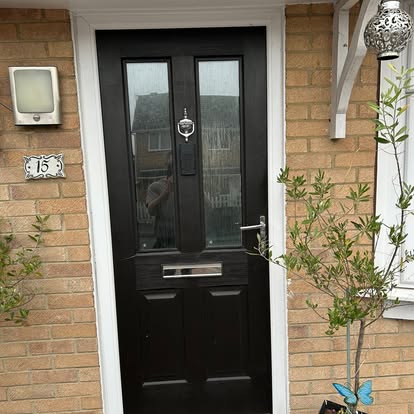 Black composite front door with glazed panels
