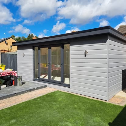 Completed grey-clad garden room with bifold doors