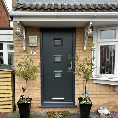 Grey composite front door with square glazing panels