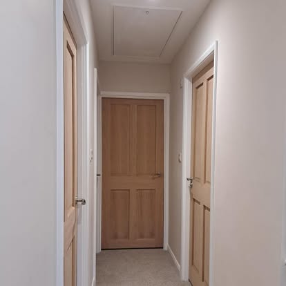 Oak 4-panel internal doors in hallway