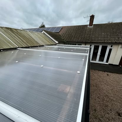 Polycarbonate carport canopy panels on bungalow