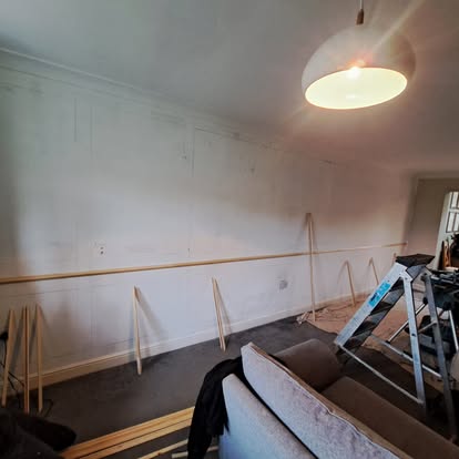 Living room wall panelling battens being fitted