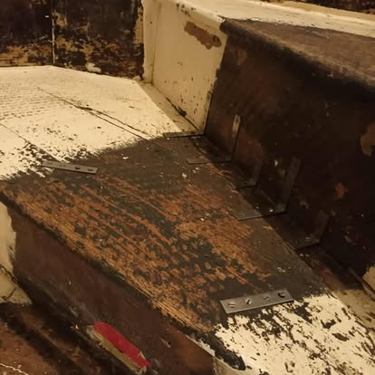 Dilapidated staircase close-up with new brackets