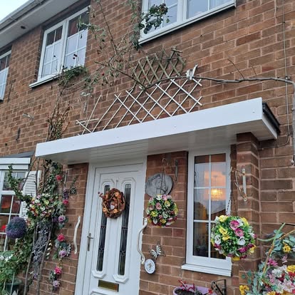 Completed white flat door canopy, summer flowers