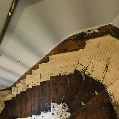 Winding staircase from above, looking down around curve