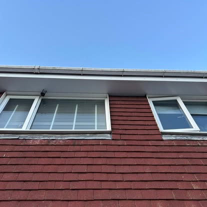 New white fascia soffit and guttering on brick house
