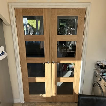 Pair of oak glazed French doors fitted in doorway