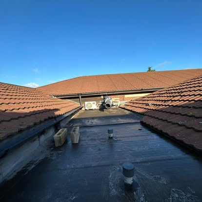 Flat roof during install, blue sky view