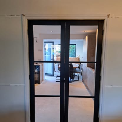 Black steel glazed internal French doors installed