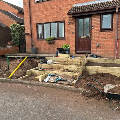 Sleepers being installed for tiered front garden