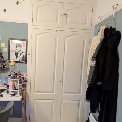 Old arched-panel wardrobe doors before replacement
