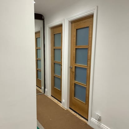 Hallway with three oak frosted-glazed internal doors