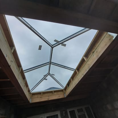 Roof lantern viewed from below, sky through glass