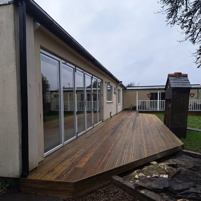Completed decking wrapping around corner of bungalow