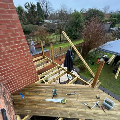 Ground-level decking with tools on boards
