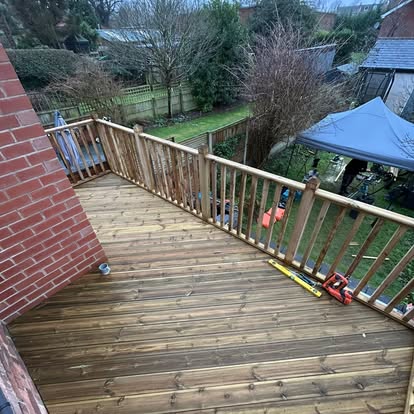 View along elevated deck, balustrade being installed