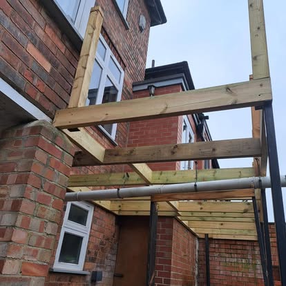 Steel post frame at rear, early stage construction