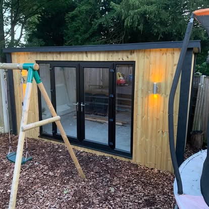 Bespoke garden room with black bifold doors