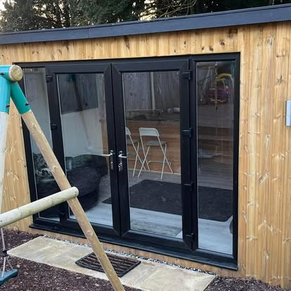 Garden room with large bifold doors and patio